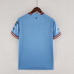 Camiseta Manchester City 2023/24 Local - detalle cuello y escudo