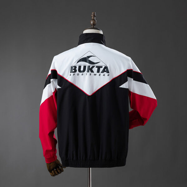 Camiseta Sevilla FC 1986 Retro Cortaviento — detalle paneles laterales y costuras