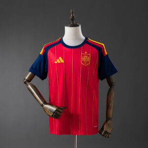 Camiseta España 2026 Local Stadium - detalle mangas y franjas