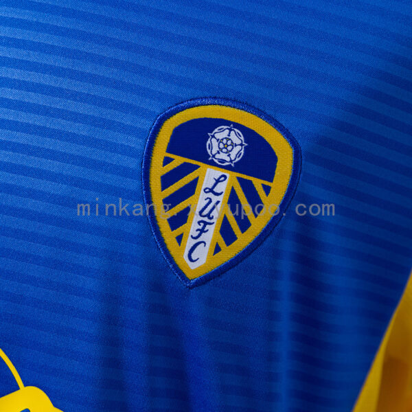 Camiseta Leeds United 2023/24 Visita - detalle manga y hombro
