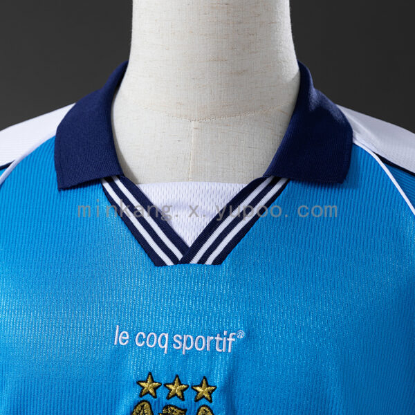 Camiseta Manchester City 1999/2000 Local Retro - detalle patrocinador EIDOS