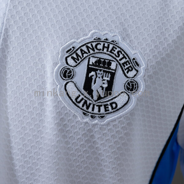 Camiseta Manchester United 2023/24 Polo - detalle hombro y las tres rayas
