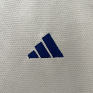Camiseta Cruzeiro 2024/25 Visita Mujer — detalle dobladillo