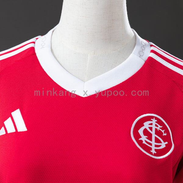 Camiseta Internacional 2023/24 Local Mujer — detalle franjas laterales