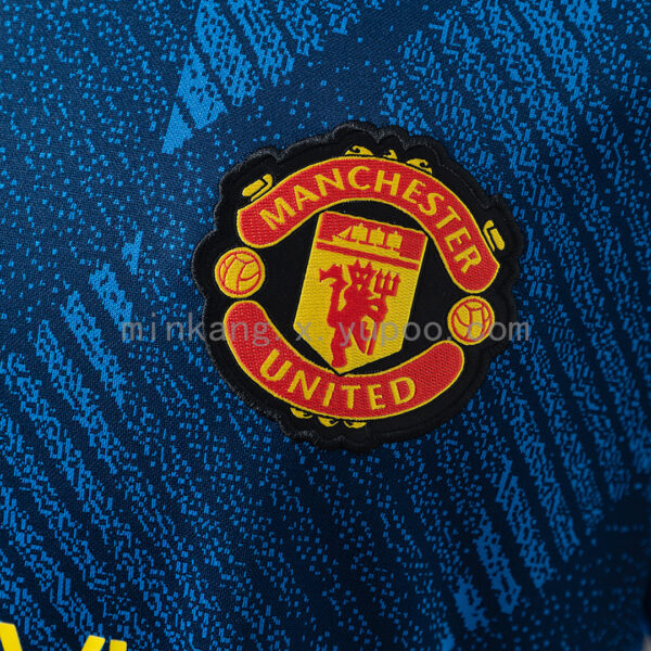 Camiseta Manchester United 2023/24 Tercera - detalle manga y franjas