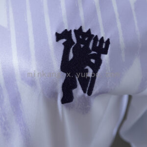 Camiseta Manchester United 2023/24 Pre-Match Mujer - detalle tejido