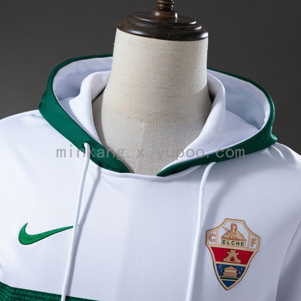 Camiseta Elche 2024/25 Local — detalle escudo