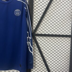 Camiseta Paris Saint-Germain 2023/24 Local Manga Larga - detalle escudo