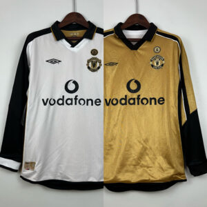 Camiseta Manchester United 2001/02 Retro Aniversario Manga Larga (dorada) y su versión blanca - vista frontal