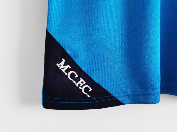 Camiseta Manchester City 2000 Retro Local - detalle sponsor EIDOS