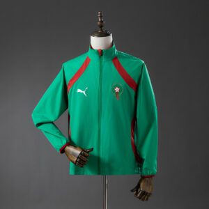 Cortavientos Marruecos 2026 Reversible Rojo y Verde - detalle escudo