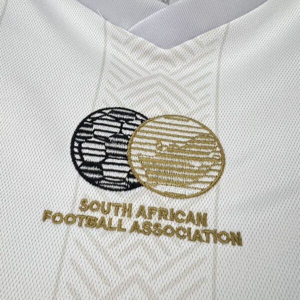 Camiseta Sudáfrica 2010 Pre-Partido Blanca - detalle material y patrón