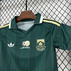 Camiseta Sudáfrica 2026 Visita Niño - detalle parte inferior